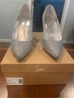 Christian Louboutin Silver Glitter Pointed Pumps in size 8.5 and 4 inch heel.